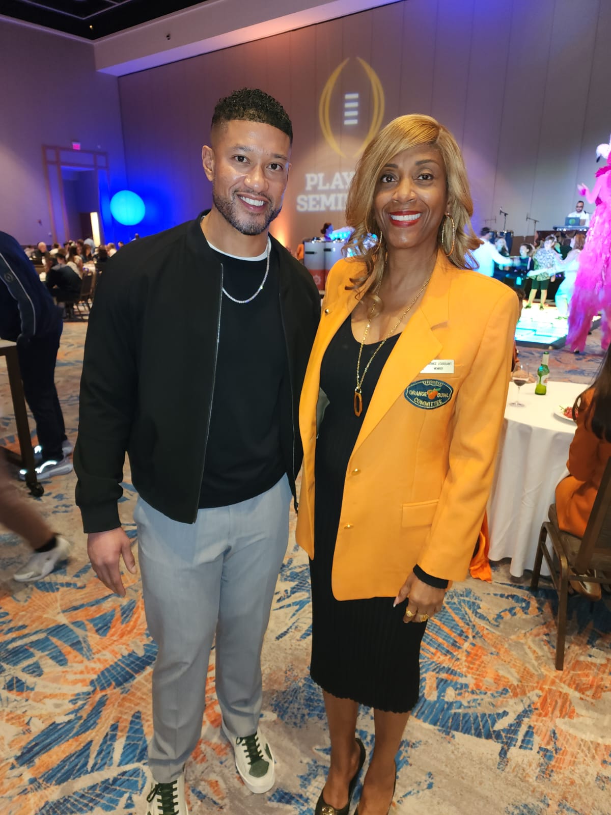 Beatrice Louissaint with Coach Marcus Freeman of Notre Dame Football